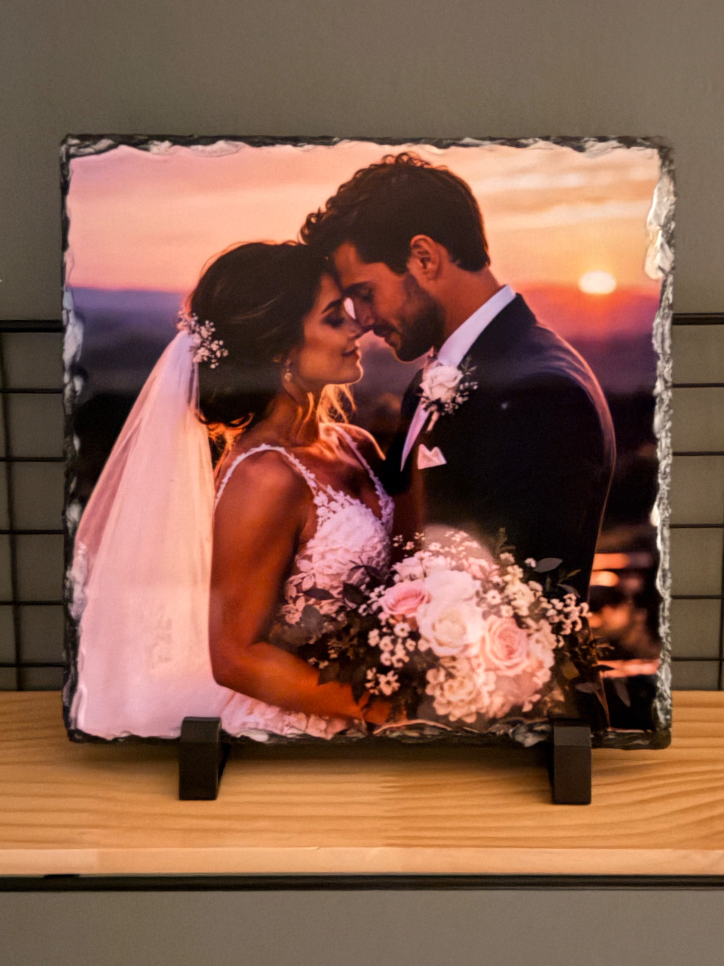Sample finished product: Ames Made Goods wedding photo slate showing a couple at sunset, displayed on its stand